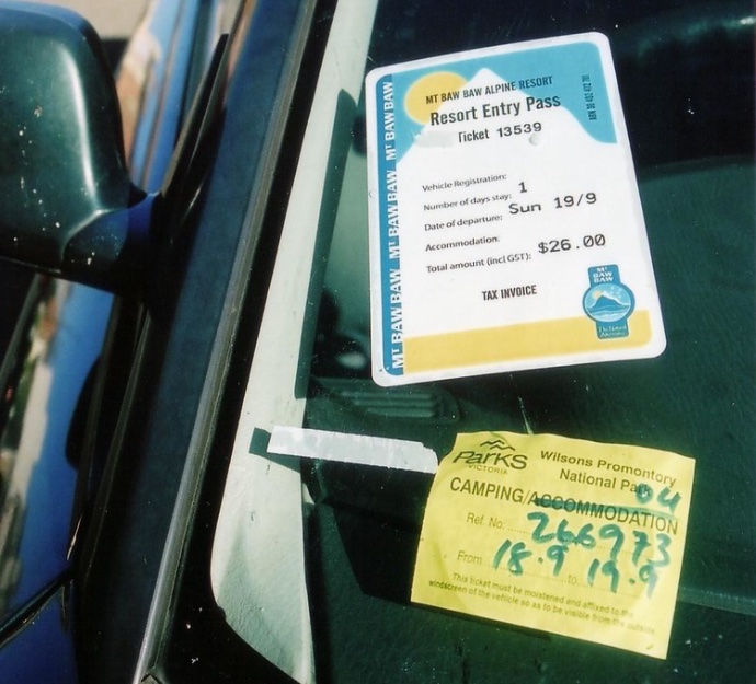 Two entry permits on a car windscreen, one for Wilsons Prom and one for Mt Baw Baw, both with the date 19/9